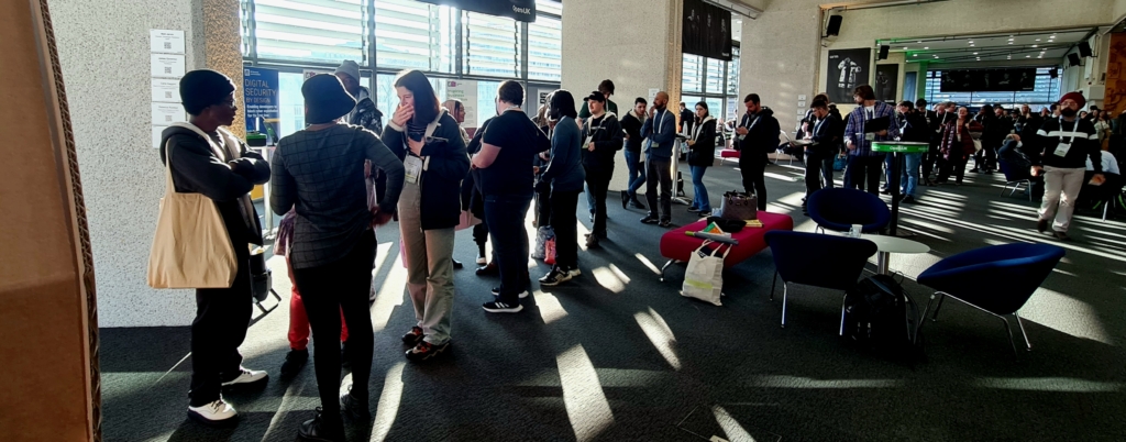 A queue of students in a large room